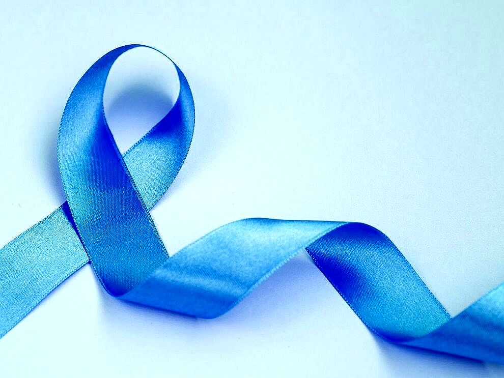above view cancer concept with blue ribbon